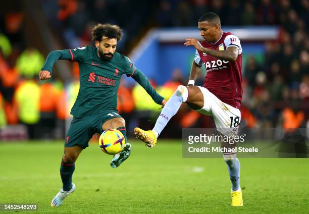 Mohamed Salah of Liverpool is challenged by Ashley Young of Aston Villa during the Premier League match between Aston Villa and Liverpool FC at Villa...