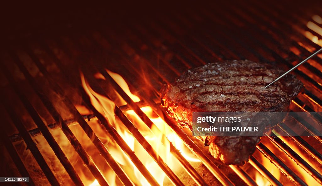 Checking internal temp - Rib-eye Steak on a BBQ