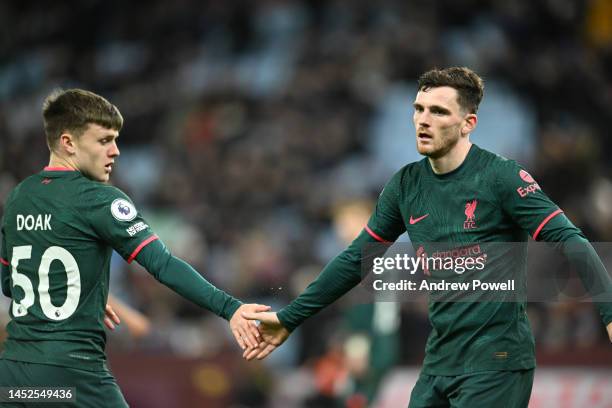 Andy Robertson of Liverpool with Ben Doak of Liverpool during the Premier League match between Aston Villa and Liverpool FC at Villa Park on December...