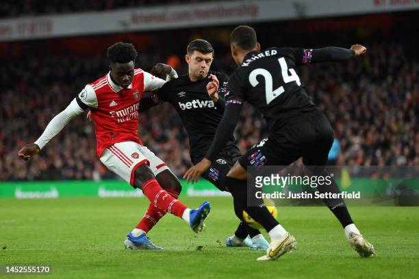 Bukayo Saka of Arsenal scores a goal which is later ruled offside during the Premier League match between Arsenal FC and West Ham United at Emirates...