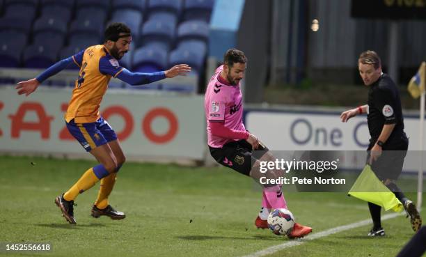 Danny Hylton of Northampton Town controls the ball watched by James Perch of Mansfield Town during the Sky Bet League Two between Mansfield Town and...