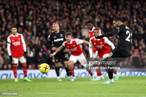 Said Benrahma of West Ham United scores their side's first goal from the penalty spot during the Premier League match between Arsenal FC and West Ham...