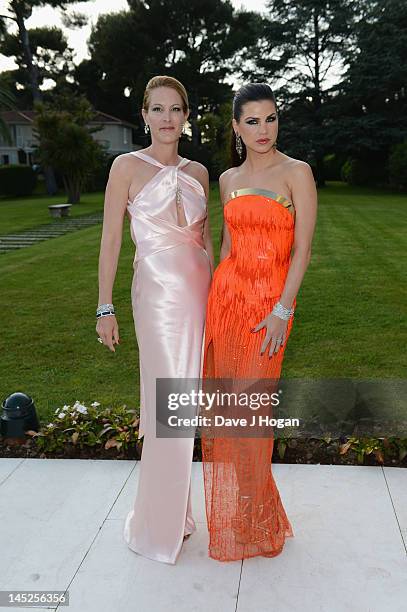 Leona Koenig and Eva Dichandattend the 2012 amfAR's Cinema Against AIDS during the 65th Annual Cannes Film Festival at Hotel Du Cap on May 24, 2012...