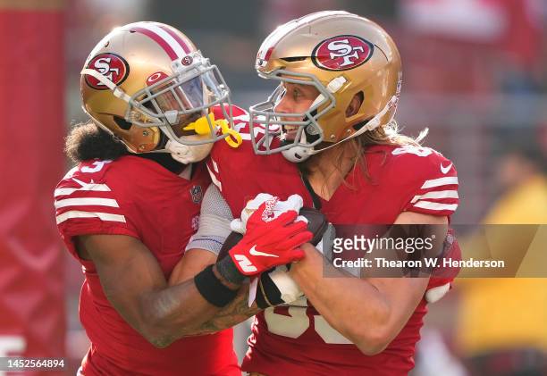 George Kittle and Ray-Ray McCloud III of the San Francisco 49ers celebrates after Kittle scored a touchdown against the Washington Commanders during...