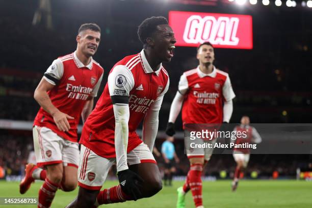 Eddie Nketiah of Arsenal celebrates after scoring their side's third goal during the Premier League match between Arsenal FC and West Ham United at...