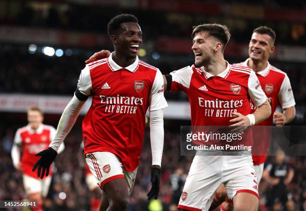 Eddie Nketiah of Arsenal celebrates with teammate Kieran Tierney after scoring their side's third goal during the Premier League match between...