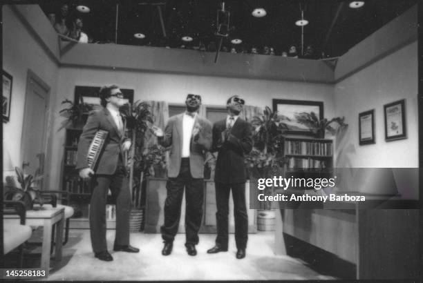 American musician Stevie Wonder appears on an episode of 'Saturday Night Live' with comedians Joe Piscopo and Eddie Murphy , New York, New York, May...