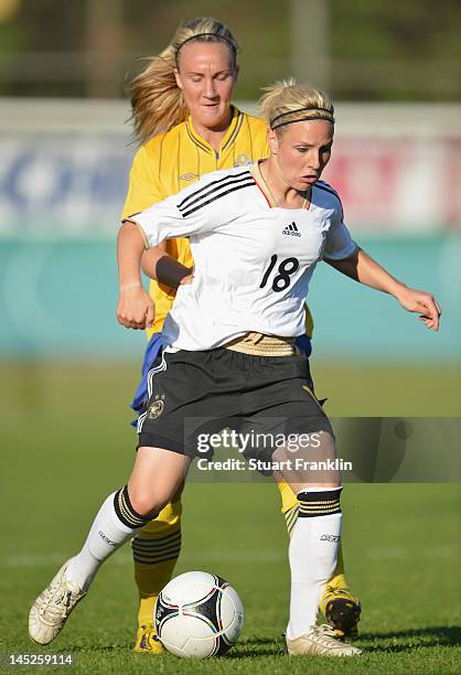 Of Germany is challenged by of Sweden during the U23's womens international friendly mtach between Germany and Sweden on May 24, 2012 in Hamburg,...