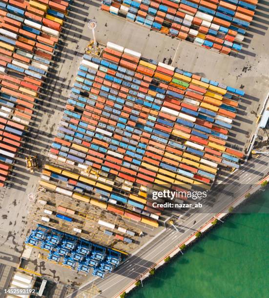 aerial view on a container port. - cargo container port stock pictures, royalty-free photos & images