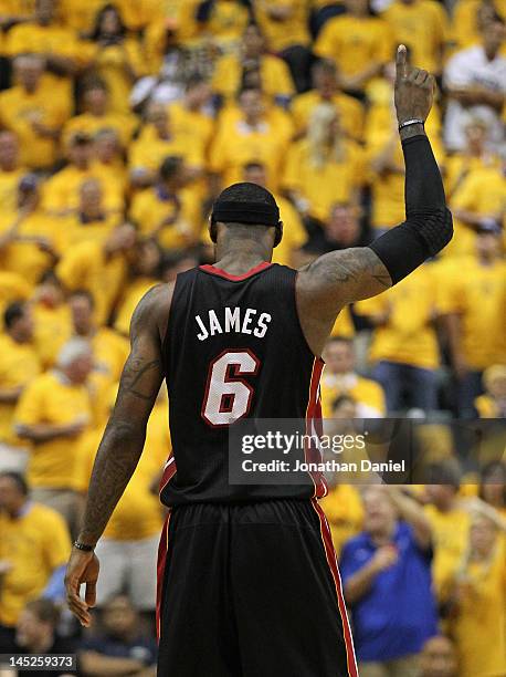 LeBron James of the Miami Heat holds up his hand before the Heat take on the Indiana Pacers in Game Six of the Eastern Conference Semifinals in the...