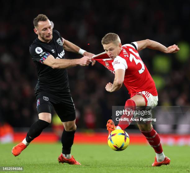 Vladimir Coufal of West Ham United pulls the shirt of Oleksandr Zinchecnko of Arsenal during the Premier League match between Arsenal FC and West Ham...