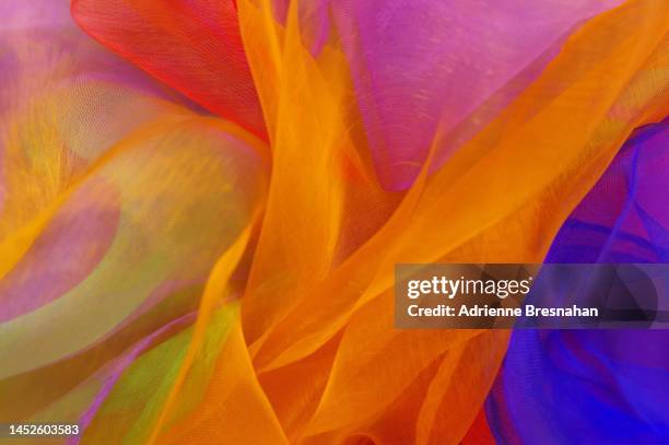 abstract pattern of chiffon scarves - orange silk background stock-fotos und bilder