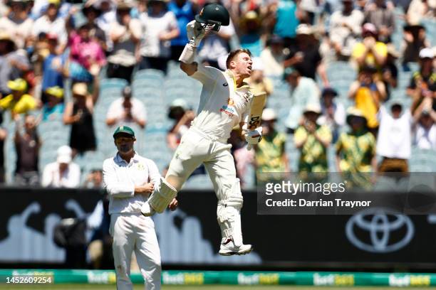 David Warner of Australia raises his bat after scoring 100 runs during day two of the Second Test match in the series between Australia and South...