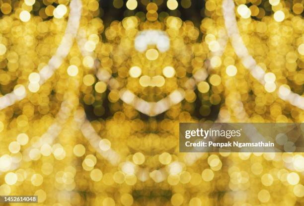 gold yellow color fantastic shiny abstract background glitter light with sparks fly defocused bokeh design festival mockup texture with blank space for your content - thailand illumination festival stock pictures, royalty-free photos & images