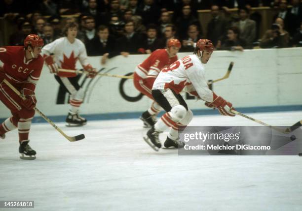 Paul Henderson of Canada skates with the puck during the 1972 Summit Series against the Soviet Union in September, 1972 at the Luzhniki Ice Palace in...