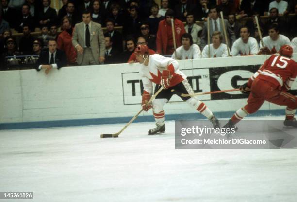 Paul Henderson of Canada skates with the puck during the 1972 Summit Series against the Soviet Union in September, 1972 at the Luzhniki Ice Palace in...