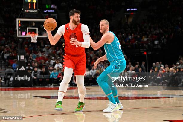 Jusuf Nurkic of the Portland Trail Blazers and Mason Plumlee of the Charlotte Hornets in action during the first quarter at thbe Moda Center on...