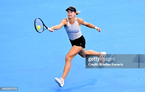 Magda Linette of Poland stretches out to play a forehand during a practice session at Pat Rafter Arena on December 27, 2022 in Brisbane, Australia.