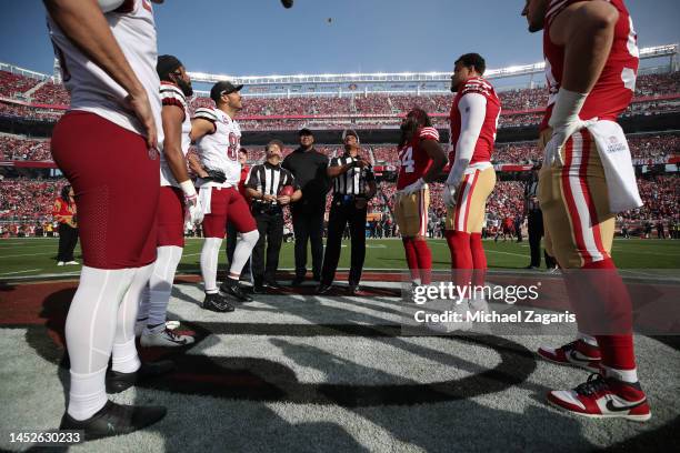 Captains of the San Francisco 49ers and the Washington Commanders before during the coin toss before the game at Levi's Stadium on December 24, 2022...