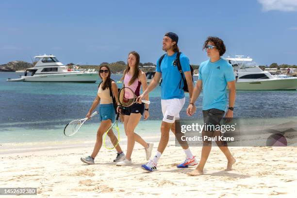 Valentini Grammatikopoulou, Despina Papamichail, Stefanos Tsitsipas and Thanasis Manekas of Team Greece walk along the beach at Parakeet Bay during a...