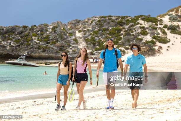 Valentini Grammatikopoulou, Despina Papamichail, Stefanos Tsitsipas and Thanasis Manekas of Team Greece walk along the beach at Parakeet Bay during a...
