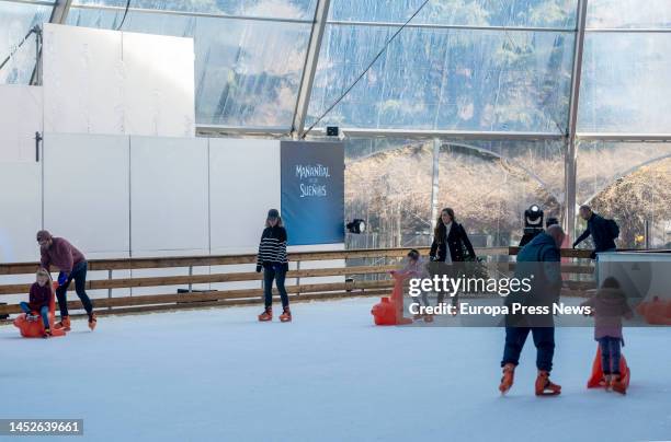 Two girls skate on the ice rink at the Manantial de Sueños Park on December 26 in Madrid, Spain. Installed in the Manantial de los Sueños theme park,...