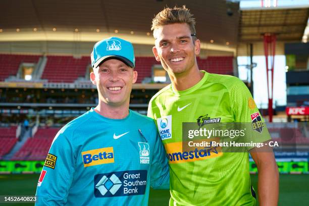Jimmy Peirson of the Heat and Chris Green of the Thunder pose for a photo during the Men's Big Bash League match between the Sydney Thunder and the...