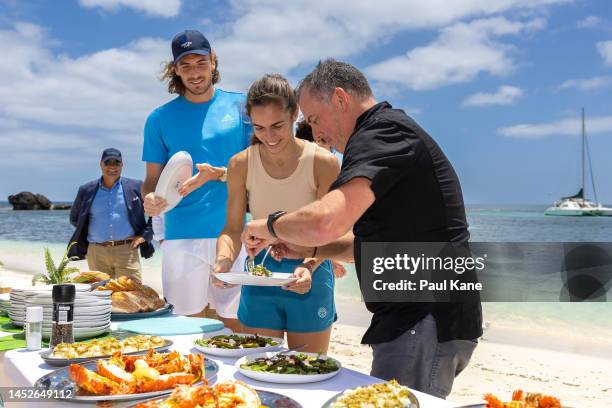 Stefanos Tsitsipas and Valentini Grammatikopoulou of Team Greece get served a seafood lunch during a United Cup media opportunity at Rottnest Island...