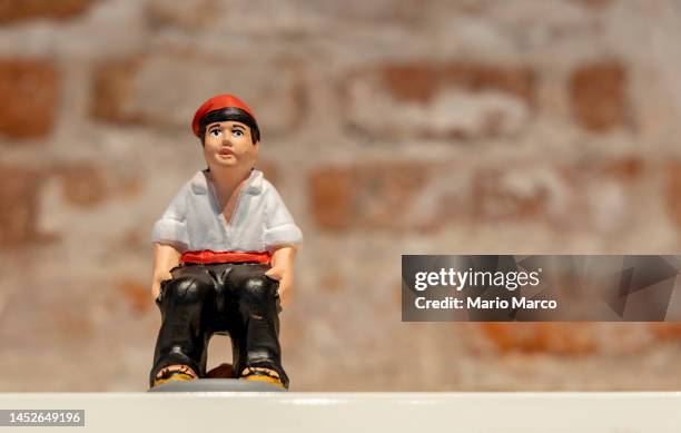 typical christmas figure "el caganer" - funny figurines stock pictures, royalty-free photos & images
