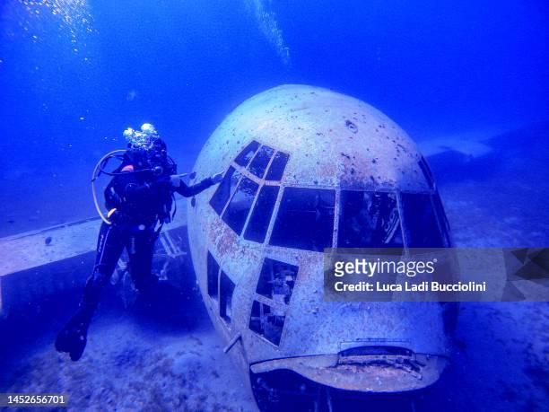 diving in aqaba on a c130 airplane wreck - aqaba stock pictures, royalty-free photos & images