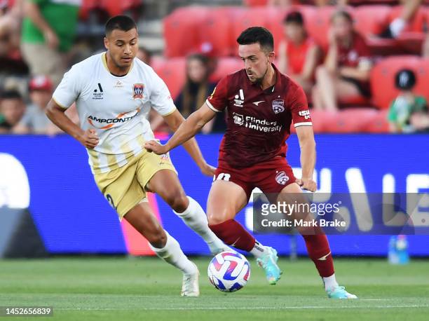 Zach Clough of Adelaide United competes with Dane Ingham of Newcastle Jets during the round nine A-League Men's match between Adelaide United and...