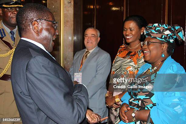 Zimbabwean President Robert Mugabe chats to Nigerian minister of Finance Dr Ngozi Okonjo-lweala with Queen of Buganda Sylvia Magginda Nnangareka...
