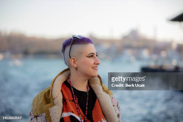 a tourist with purple hair is traveling in istanbul. - purple hair stock pictures, royalty-free photos & images