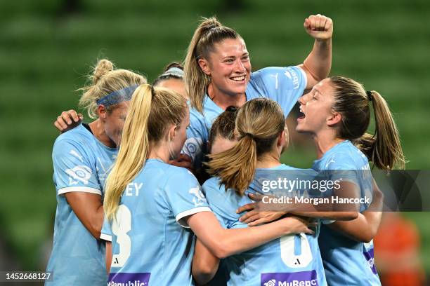 Rhianna Pollicina jumps over the top of City players as the celebrate after Emina Ekic of Melbourne City scored a goal during the round seven...