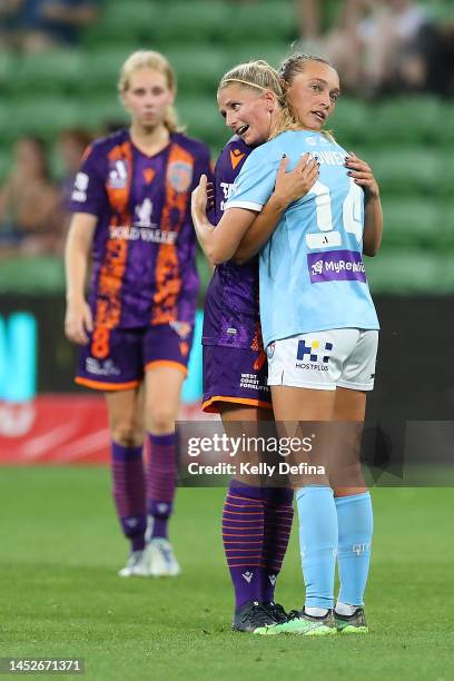 Valon Berisha of City and Elizabeth Anton of the Glory hug after the match during the round seven A-League Women's match between Melbourne City and...