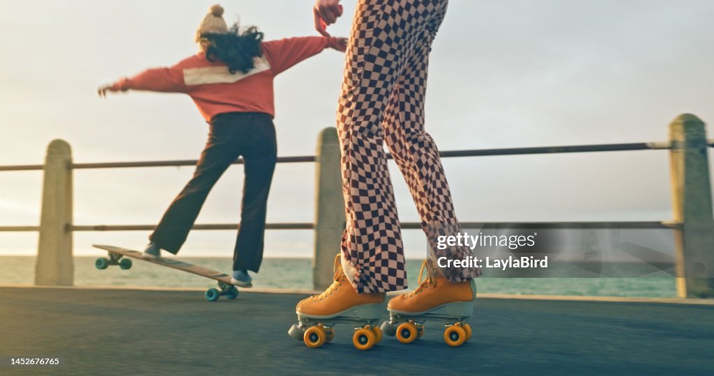 Summer, fun and friends skateboard and rollerskate together by the ocean on holiday, vacation and weekend. Freedom, fashion and girls enjoy skating, leisure hobby and recreation sport for adventure