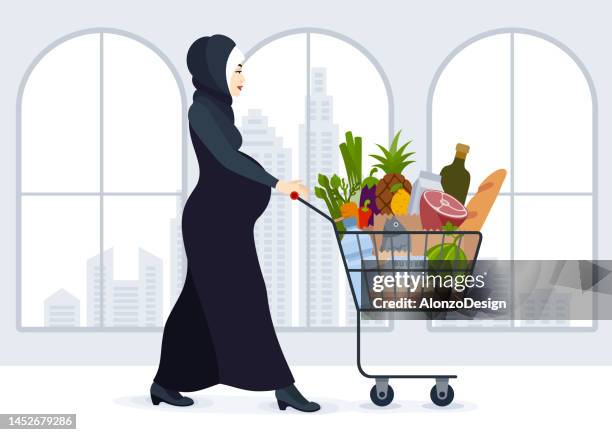 illustrations, cliparts, dessins animés et icônes de femme enceinte faisant ses courses.  future mère musulmane. - caddie rempli