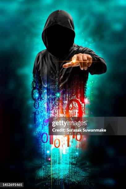 faceless hackers and malware hackers use laptops with dangerous digital code on binary code background. - stealing idea stock pictures, royalty-free photos & images