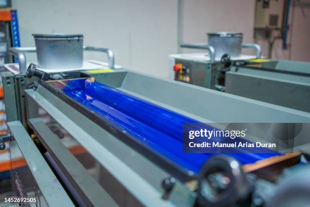 printing press loading blue ink into an offset machine - bearings metal stock pictures, royalty-free photos & images