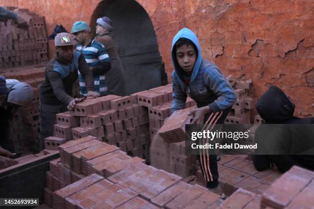 Children works in brick factories on December 26, 2022 in Fayoum, Egypt. According to an estimate issued by the International Labor Organization in...