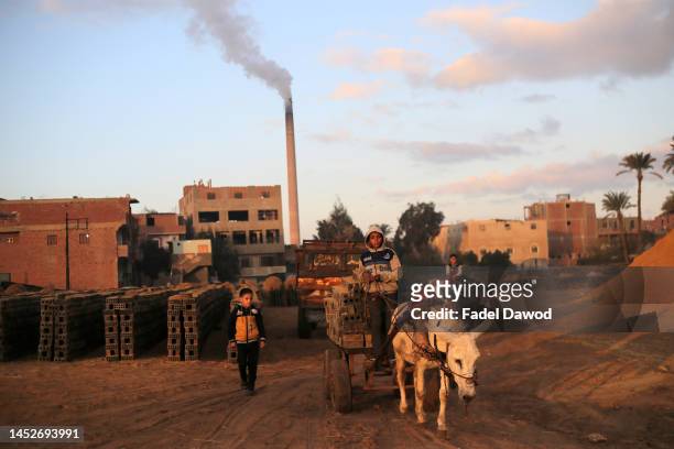Children works in brick factories on December 26, 2022 in Fayoum, Egypt. According to an estimate issued by the International Labor Organization in...