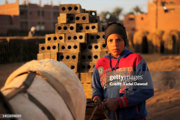 Children works in brick factories on December 26, 2022 in Fayoum, Egypt. According to an estimate issued by the International Labor Organization in...