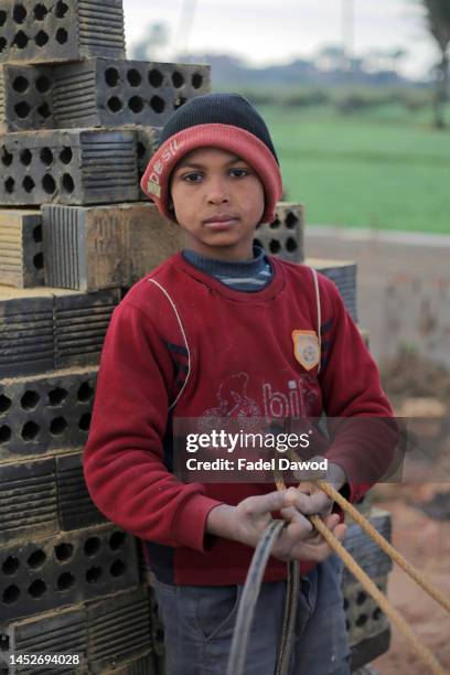 Children works in brick factories on December 26, 2022 in Fayoum, Egypt. According to an estimate issued by the International Labor Organization in...