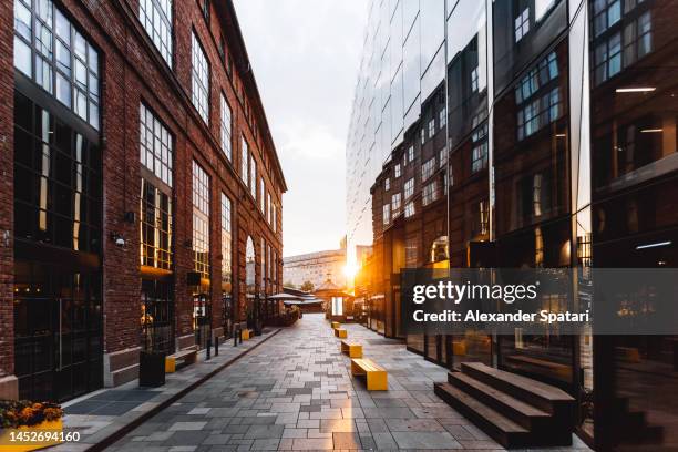 sun reflecting in modern office buildings in akker brygge district in oslo, norway - house golden hour stock pictures, royalty-free photos & images