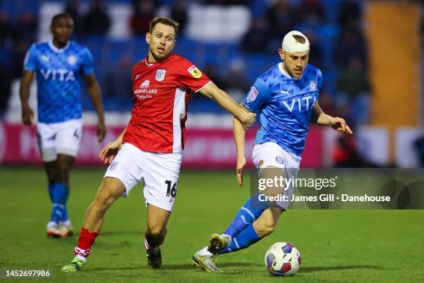 Ryan Croasdale of Stockport County battles for possession with Charlie Colkett of Crewe Alexandra during the Sky Bet League Two between Stockport...