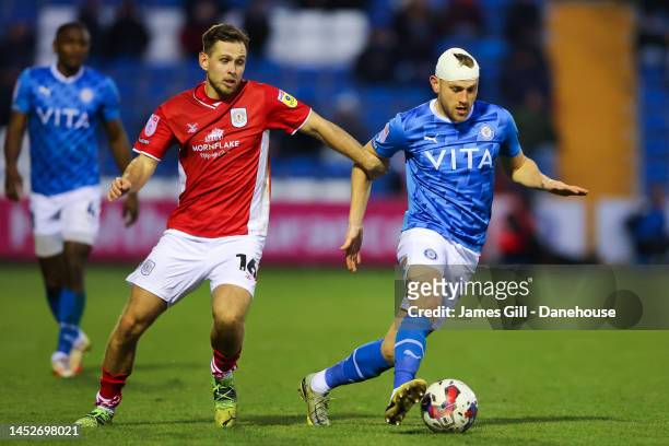 Ryan Croasdale of Stockport County battles for possession with Charlie Colkett of Crewe Alexandra during the Sky Bet League Two between Stockport...