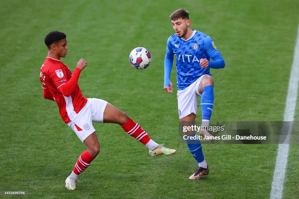 Ryan Rydel Ryan Rydel of Stockport plays a pass beyond Rio Adebisi of Crewe ...
