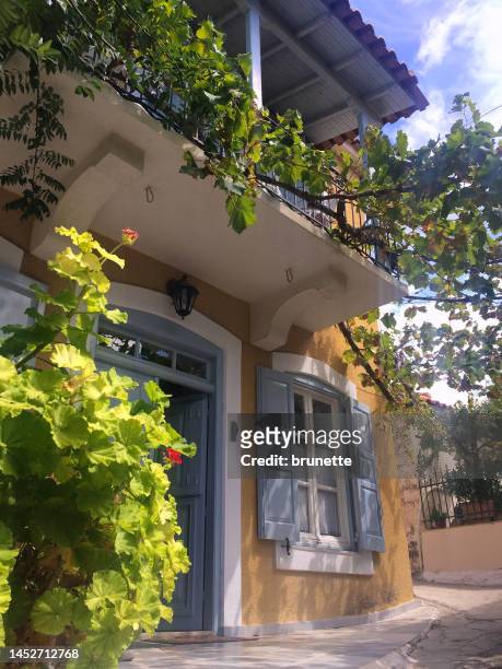 yellow house in vine, greece - epidaurus stock pictures, royalty-free photos & images