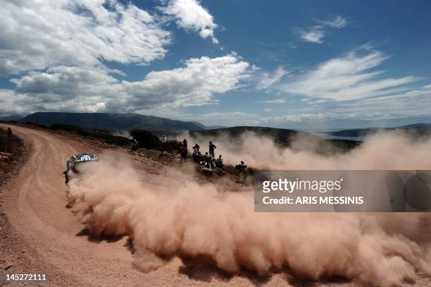 Driver competes during the Bauxites special stage of the WRC Acropolis rally in Itea on May 25, 2012. AFP PHOTO / ARIS MESSINIS