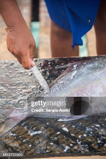 Freshly Caught Fish Being Descaled In Cape Verde High-Res Stock Photo ...